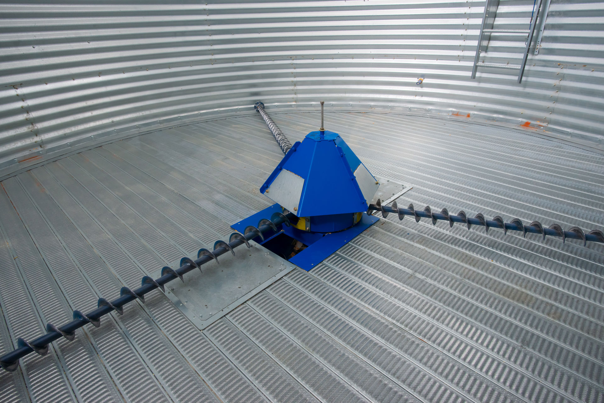 Inside of a grain bin with Shivvers grain spreaders | Shivvers